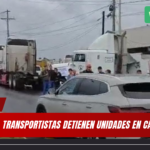 TRANSPORTISTAS DETIENEN UNIDADES EN CABEZA OLMECA